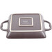 A square brown stoneware baking dish with two white handles.
