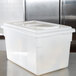 A white plastic Carlisle food storage lid on a white container.