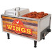 A Benchmark USA countertop chicken wing warmer with chicken wings inside.