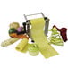 A Bron Coucke stainless steel vegetable lasagna slicer cutting vegetables and pasta.