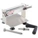 A Bron Coucke stainless steel vegetable lasagna slicer on a counter with two metal rods.