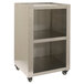 A Benchmark USA silver stainless steel pedestal base with two shelves on wheels.