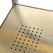 A close-up of a metal surface with holes.