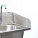 A stainless steel Eagle Group hand sink with a faucet.