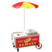 A Benchmark USA hot dog cart with a red and yellow umbrella.