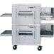A large stainless steel Lincoln Impinger double conveyor oven with two belts.