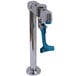 A chrome metal deck mount glass filler faucet with a blue handle.