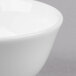 A close up of a white Reserve by Libbey bone china round bouillon bowl.