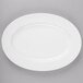 A white bone china oval platter with a white rim.