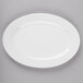 A white oval platter on a gray surface.