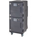A charcoal grey Cambro food holding cabinet with wheels.