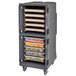 A Cambro Pro Cart Ultra in charcoal gray with trays of food inside.