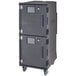 A charcoal grey Cambro Pro Cart Ultra food holding cabinet with wheels.