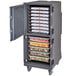 A Cambro tall profile food holding cabinet in charcoal grey with trays of food inside.