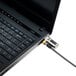 A black Kensington laptop lock cable attached to a laptop.