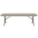 A Correll rectangular folding table with metal legs and a grey granite surface.