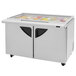 A Turbo Air 60" 2 door refrigerated sandwich prep table with glass lids open showing food.