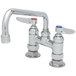 A T&S chrome deck-mounted pantry faucet with two handles.
