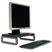 A black Kensington monitor stand with a computer monitor and keyboard on it.