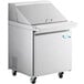 An Avantco stainless steel refrigerated sandwich prep table on wheels.
