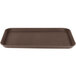 A brown rectangular Carlisle Griptite non-skid fiberglass serving tray.