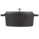 An American Metalcraft pre-seasoned black cast iron oval Dutch oven with a lid.