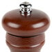 A Fletchers' Mill Federal walnut stain wooden pepper mill with a metal top.