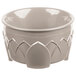 A white Dinex Fenwick insulated bowl with a carved design.