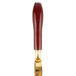 A Franmara brass-plated wine bottle opener with a red cylinder and gold ring.