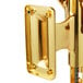 A gold metal wall mount with a metal hook for a Franmara brass-plated wine bottle opener.