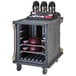 A granite gray Cambro meal delivery cart with trays on a shelf.