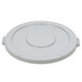 A gray plastic lid with a white plastic circle and a handle.