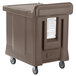 A brown Cambro meal delivery cart with wheels.