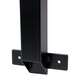 A black metal Lancaster Table & Seating cantilever table bracket with holes.