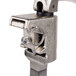 A close-up of an Edlund stainless steel manual can opener clamp with a metal ring.