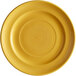 A yellow Tuxton Concentrix China plate with a circular spiral pattern.