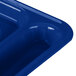 A close up of a blue Carlisle polypropylene compartment tray with 6 compartments.