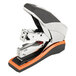 A black and silver Swingline stapler with an orange handle.