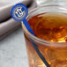 A glass of iced tea with a blue WNA Comet disc stirrer in it.