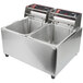 A Cecilware electric countertop deep fryer with two stainless steel pans.