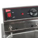 A Cecilware commercial electric countertop deep fryer with red knobs and black handles.