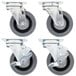 A set of four metal swivel plate casters with black rubber wheels.