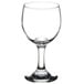 A close-up of a clear Libbey wine glass.