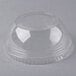 A clear plastic Fabri-Kal dome lid with a hole on a table.