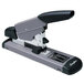A Swingline heavy-duty stapler with a black and grey handle.