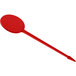A red plastic stick with a long handle and a point.