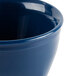A close-up of a navy blue Cambro insulated plastic bowl.
