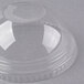 A clear plastic Fabri-Kal dome lid with a hole.