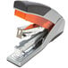 A grey and orange Swingline Optima stapler.
