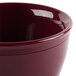 A close-up of a red Cambro insulated plastic bowl.